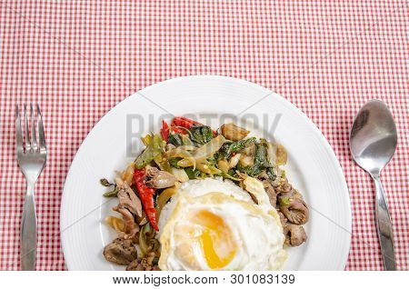 Fried Rice With Basil Leaves And Red Cloth On The Table.ngredients Of Basil Fried Chicken And Fried 
