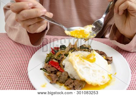 Fried Rice With Basil Leaves And Red Cloth On The Table.ngredients Of Basil Fried Chicken And Fried 