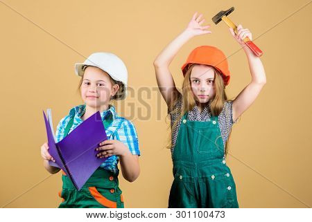 Happy Children. Future Career. Small Girls Repairing Together In Workshop. Labor Day 1 May. Little K