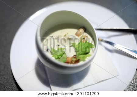 Bowl With Rapans In Cream Sauce In Restaurant