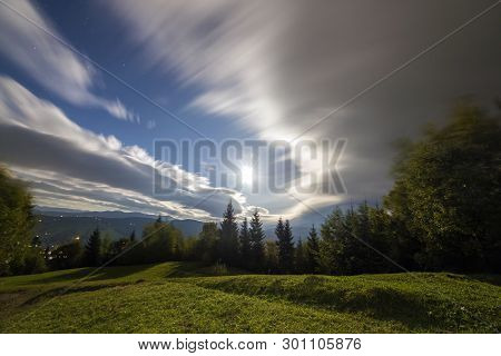 Summer Night Mountain Panorama. Green Trees On Grassy Mountain Clearing On Cloudy Evening Sky Copy S