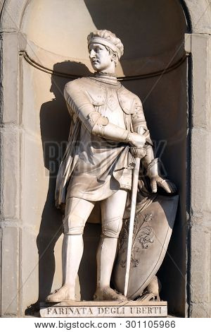 FLORENCE, ITALY - JANUARY 11, 2019: Farinata degli Uberti, statue in the Niches of the Uffizi Colonnade in Florence, Italy