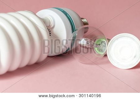 Close Up View Of White Light Bulb Isolated On Pink.