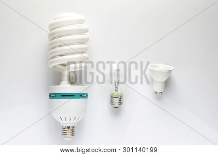 Close Up View Of White Light Bulb Isolated On Pink.