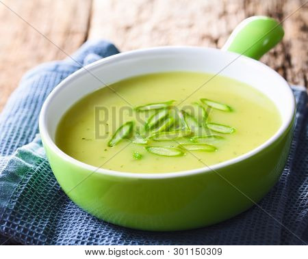 Cream Of Green Asparagus Soup In Bowl, Garnished With Sliced Asparagus On Top (selective Focus, Focu