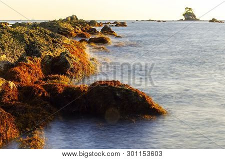 Long Exposure Of Rocky Sea Shore & Blue Water On Sunset. Seascape,south China Sea Coastline, Seaside