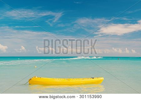 Enjoy Summer. Spend Vacation Exciting Occupation St.johns Antigua. Sea Turquoise Water Yellow Canoe 