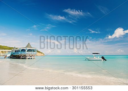 Enjoy Benefits Being Beside Sea. Sea Turquoise Water Bungalow And Ship Near Beach. Vacation Sea Sand