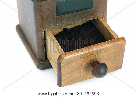 Manual Coffee Grinder On A White Background. Antiquary