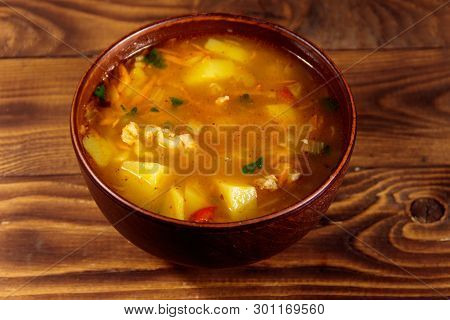 Kharcho Soup With Meat And Rice On Wooden Table