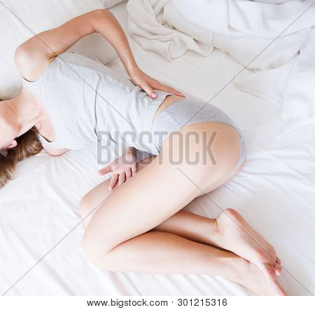 Not Comfortable Bed, Cropped Portrait Woman With Back Pain At Home In The Bedroom