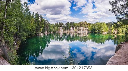 Lake And Ancient Pines Growing Between Them Located In Rock City Adrspach, National Park Of Adrspach
