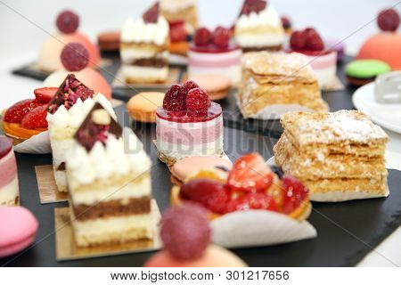 desserts with fruits, mousse and biscuits on plate