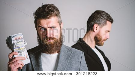Scam And Deception. Man Bearded Fraudster Hold Cash Money While Victim Stand Sad Background. While N
