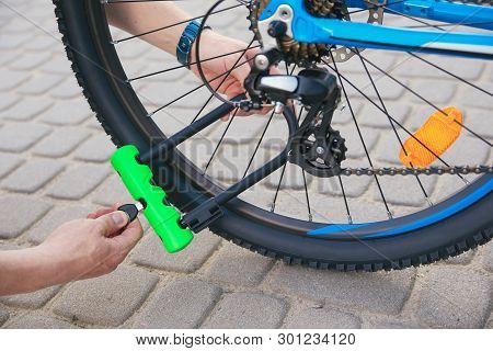 Bicycle Lime Green U- Lock In Hands