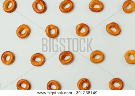 Drying Or Bagels On A White Background, Periodic Drawing, Flat Lay, Bright Colors, High Contrast