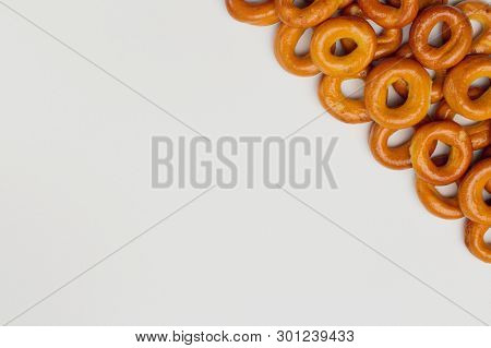 Appetizing Crispy Drying Or Bagels On A White Background, There Is A Place For Text. Bright Colors, 