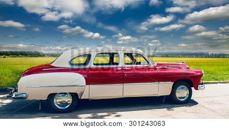 Russia. Rostov region. 07/01/2017 . Old, retro luxury car 1952 model year. Classic style of the mid 20th century. Parked in nature overlooking beautiful green fields.