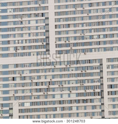 Facade Of An Apartment Building With Many Windows