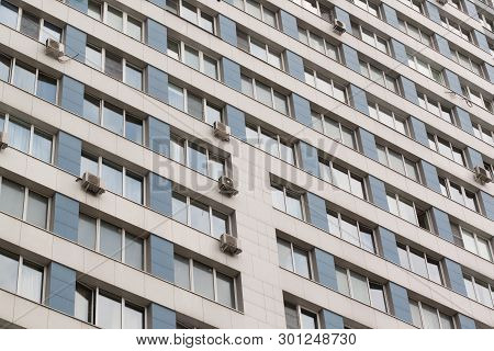 Facade Of An Apartment Building With Many Windows
