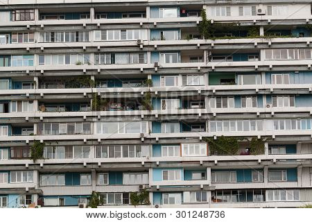 Facade Of Apartment Block With Many Windows