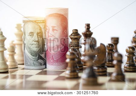 Us Dollar And Yuan Banknote With Chess For Tariff Trade War Between United States And China Which Bo