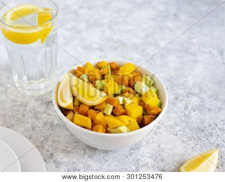 Pegan Salad With Mango, Avocado And Sweet Potatoes, Served With Lemon Water. Paleo Diet. Pegan Diet.