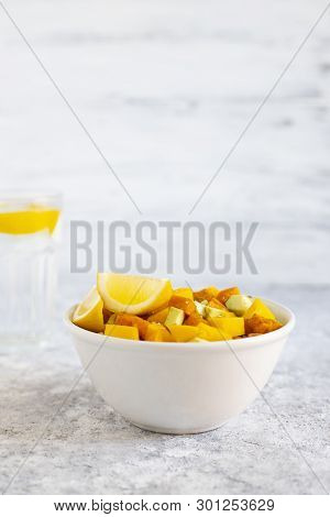 Pegan Salad With Mango, Avocado And Sweet Potatoes, Served With Lemon Water. Paleo Diet. Pegan Diet.