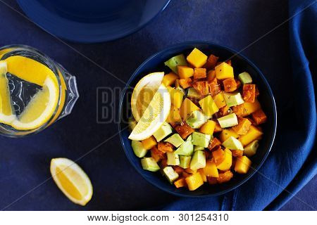 Pegan Salad With Mango, Avocado And Sweet Potatoes, Served With Lemon Water. Paleo Diet. Pegan Diet.