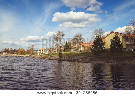 Beautiful Views Of The Lake, The Houses, Birch And Forest. Finnish Landscape. Lakes And Valleys. Sum