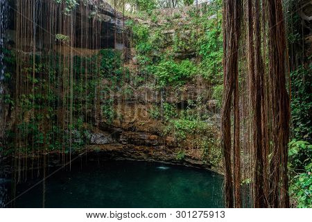 Cenote Ecoturistico Ik-kil With Blue Clear Water