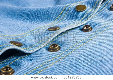 Blue Washed Faded Jeans Texture With Seams, Clasps, Buttons And Rivets