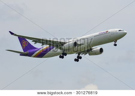 Passenger Airplane Landing At Bangkok Airport