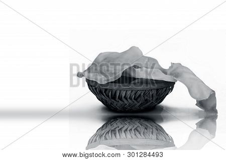 Papad Or Papadum In A Clay Bowl Isolated On White With Its Reflection.