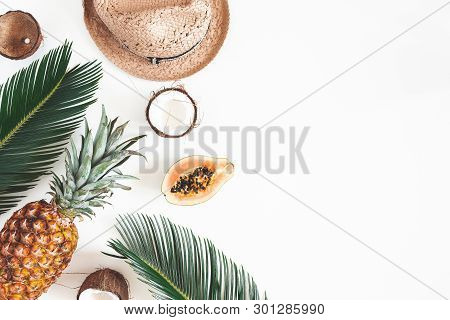 Summer Composition. Tropical Palm Leaves, Hat, Coconut, Pineapple, Papaya On White Background. Summe