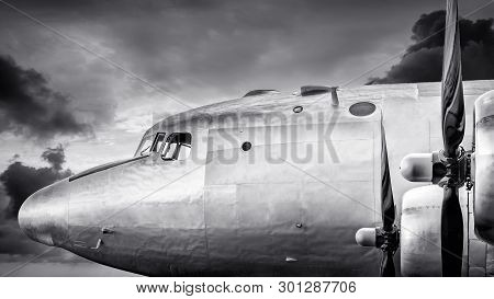 Cockpit Of An Historical Aircraft Against An Dramatic Sky