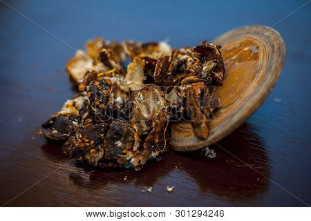 Raw Peeled Tamarind Or Imli In A Clay Bowl On Wooden Surface.