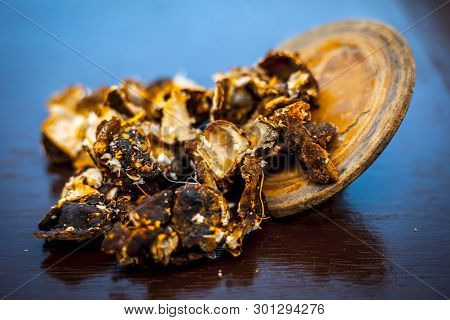Raw Peeled Tamarind Or Imli In A Clay Bowl On Wooden Surface.
