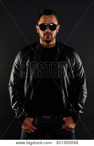 Brutal Macho In Leather Jacket. Bearded Man In Fashion Sunglasses. Mens Sexuality And Attraction. Fa