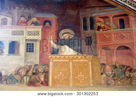 FLORENCE, ITALY - JANUARY 10, 2019: Preaching of Saint Peter, fresco by Andrea di Bonaiuto in Spanish Chapel, Santa Maria Novella Principal Dominican church in Florence, Italy