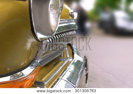Retro Car On A Blurred Background Of City Park On Expo