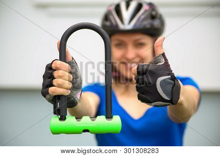 Girl With Bicycle  Lock. Bicycle U- Lock. Bike Protection