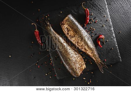 Marinated Mackerel Or Herring Fish With Spices, Pepper On Slate Stone Background. Mediterranean Food