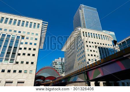 London, England - May 5, 2013: Canary Wharf, Dlr Station With Several Bank Buildings As A Backdrop.