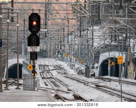 Railway Lines And Complicated Grid Of Catenary Power Cables At The Railway Station In Sandvika, A Su