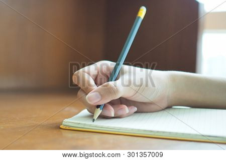 Woman's Hand Is Writing