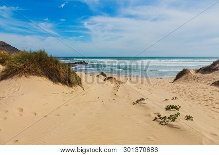 Dunes and sea landscape at the Praia da Amoreira beach in the west Algarve. Portugal