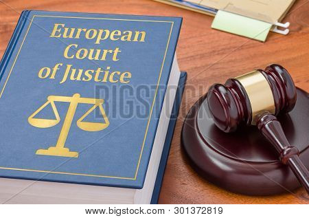A Law Book With A Gavel - Ecj
