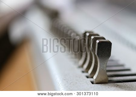 Bookbinding Machine. Printing Equipment. Industrial Tool.  Macro.