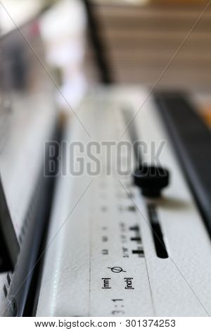 Bookbinding Machine. Printing Equipment. Industrial Tool. Macro.